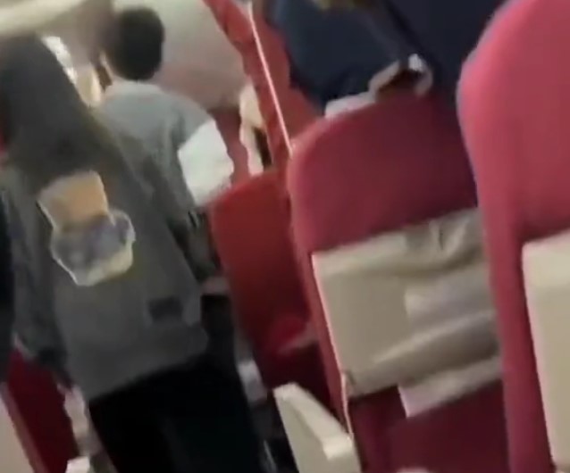 Chinese Guy Freaking Out on a Plane